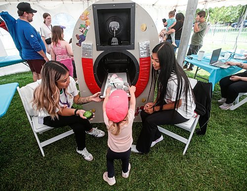 JOHN WOODS / FREE PRESS
Jade Sydney, right, and Riianna, x-ray technology students from the Children's Hospital diagnostic imagining department, &#x201c;scan&#x201d; a stuffy at the Teddy Bears&#x2019; Picnic in Assiniboine Park  Sunday, September 8, 2024. 

Reporter: tyler