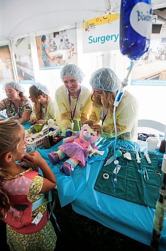 JOHN WOODS / FREE PRESS
Kaitlyn Wiebe, right, and Brynn Arksey, Red River student nurses, patch up Elsa the bear for Reagan at the Teddy Bears&#x2019; Picnic in Assiniboine Park  Sunday, September 8, 2024. 

Reporter: tyler