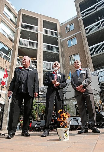 JOHN WOODS / FREE PRESS
Eugene Hyworon, Millennium Villa Board president, centre, is joined by board members Rod Noseworthy, left, and Dale Fuga, right,  as they burn the mortgage for St Mary The Protectress Millennium Villa during a community celebration Sunday, September 8, 2024. The  church and senior communities came together to celebrate paying off their villa&#x573; 35 year mortgage.

Reporter: standup