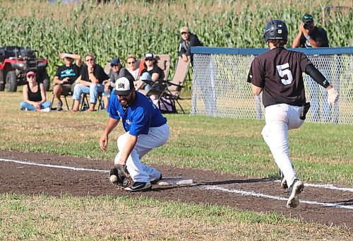 Team West first baseman Mitch Olson of Deloraine scoops up a low throw to put out Team East&#x2019;s Rylan Penner during the Field of Dreams tournament in Clearwater on Saturday. The three-team event drew hundreds of baseball fans out to the diamond designed by Joe Gardiner and a bevy of community volunteers. (Perry Bergson/The Brandon Sun)
Sept. 7, 2024