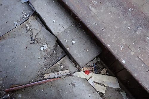 A poppy is face down at the front of the Berbank Memorial Church. The church was built in 1919 in honour of four locals who died during the first world war. It has fallen into disrepair, with birds nesting inside. (Connor McDowell/Brandon Sun)