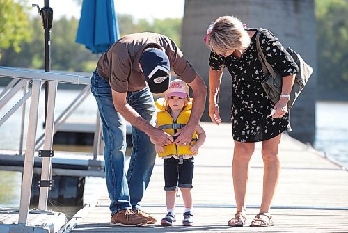 Ruth Bonneville / Free Press

Standup - Seas the day 

Three-year-old Daphne Prendergast gets her life jacket buckled up by her grandparents Dora and Doug Lawrie just before heading boarding the Winnipeg Waterways' river tour boat Monday morning.  Her hat which says Seas the day, was the perfect pairing for her adventure with her grandparents on the water.  


Sept 9th,  2024