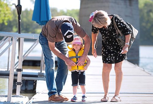 Ruth Bonneville / Free Press

Standup - Seas the day 

Three-year-old Daphne Prendergast gets her life jacket buckled up by her grandparents Dora and Doug Lawrie just before heading boarding the Winnipeg Waterways' river tour boat Monday morning.  Her hat which says Seas the day, was the perfect pairing for her adventure with her grandparents on the water.  


Sept 9th,  2024