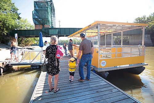 Ruth Bonneville / Free Press

Standup - Forks Weather shot

Three-year-old Daphne Prendergast and her grandparents Dora and Doug Lawrie prepare to step aboard the Winnipeg Waterways' river tour boat Monday morning.  

Sept 9th,  2024