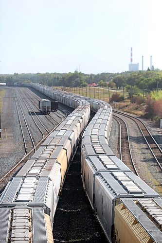 The cars of a pair of freight trains snake down the tracks of the Canadian Pacific train yard in Brandon on Monday afternoon. (Matt Goerzen/The Brandon Sun)