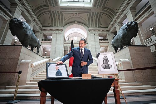 Ruth Bonneville / Free Press

Local  - book of condolences

Photo of Premier Wab Kinew, kissing his hand and placing it on one of Cathy Merrick's photos after signing the book of condolences Tuesday. 

Manitoba's Lieutenant-Governor Anita Neville, Premier Wab Kinew, interim opposition Leader Wayne Ewasko and  Mayor Scott Gillingham, along with other elected officials, are the first to  sign book of condolences for the late grand chief Cathy Merrick at the legislature Tuesday.



Sept 10th,  2024