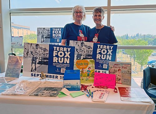 Syndy Wright and Heather Stewart set up a Terry Fox Run booth at the Health Checks Health & Wellness Expo at Brandon University's Healthy Living Centre on Tuesday. Brandon's Terry Fox Run is scheduled to run from 10 a.m. to noon starting at the BU library this Saturday. (Colin Slark/The Brandon Sun)