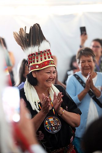 Wearing a ceremonial headress, Assembly of Manitoba Chiefs Grand Chief Cathy Merrick takes her oath of office following her first-ballot victory for the position on Wednesday afternoon during the 36th Annual General Assembly that was held on Waywayseecappo First Nation land near Brandon. (Matt Goerzen/The Brandon Sun)