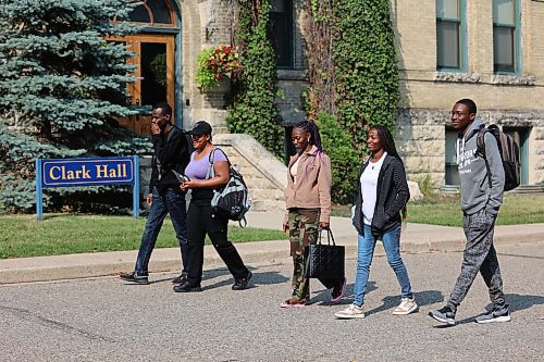 Brandon University's international students walk in front of Clark Hall towards the Knowles Douglas Building on Tuesday. (Abiola Odutola/The Brandon Sun)