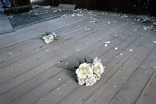 Plastic flowers lay on the floor years after they were lain for a monument of four locals who fought and died in the first world war. (Connor McDowell/Brandon Sun)