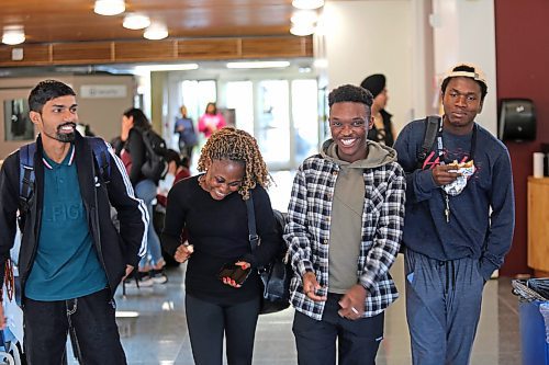 Assiniboine College international students Ashish Kumar from India (from left), Oluwaseyi Akinsanya from Nigeria, Israel Adeniran from Nigeria and Dara Ayorinde from Nigeria engage in banter as they walk to the campus cafeteria on Wednesday afternoon. (Abiola Odutola/The Brandon Sun)