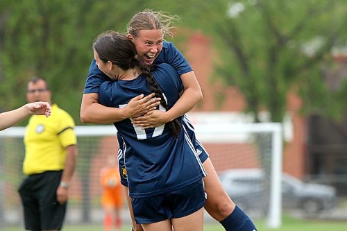 Brandon University Bobcats defender Ireland Staples, facing the camera, celebrates her first goal of the MCAC women's soccer season against the Assiniboine College Cougars at the Healthy Living Centre field on Wednesday. (Thomas Friesen/The Brandon Sun)