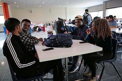 Left; Assiniboine College International Students Ashish Kumar (Finance Advanced), Israel Adeniran (Digital Art and Design), Dara Ayorinde (Network Administration Technology), and Oluwaseyi Akinsanya (Finance Advanced),  gist after their lunch at the Victoria Ave. East Campus cafeteria on Wednesday afternoon. (Abiola Odutola/The Brandon Sun)