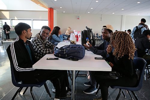 Left; Assiniboine College International Students Ashish Kumar (Finance Advanced), Israel Adeniran (Digital Art and Design), Dara Ayorinde (Network Administration Technology), and Oluwaseyi Akinsanya (Finance Advanced),  gist after their lunch at the Victoria Ave. East Campus cafeteria on Wednesday afternoon. (Abiola Odutola/The Brandon Sun)