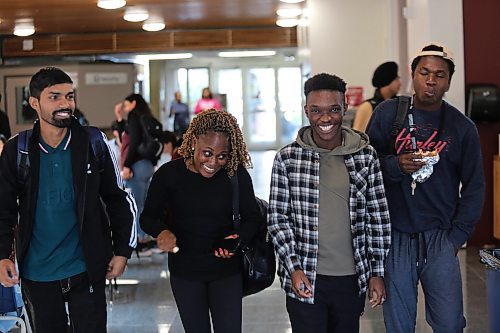 Left; Assiniboine College International Students Ashish Kumar (Finance Advanced), Oluwaseyi Akinsanya (Finance Advanced), Israel Adeniran (Digital Art and Design), and Dara Ayorinde (Network Administration Technology) gist as they walk to the Victoria Ave. East Campus cafeteria on Wednesday afternoon. (Abiola Odutola/The Brandon Sun)