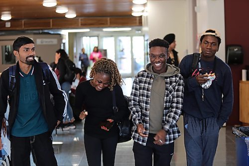 Left; Assiniboine College International Students Ashish Kumar (Finance Advanced), Oluwaseyi Akinsanya (Finance Advanced), Israel Adeniran (Digital Art and Design), and Dara Ayorinde (Network Administration Technology) gist as they walk to the Victoria Ave. East Campus cafeteria on Wednesday afternoon. (Abiola Odutola/The Brandon Sun)