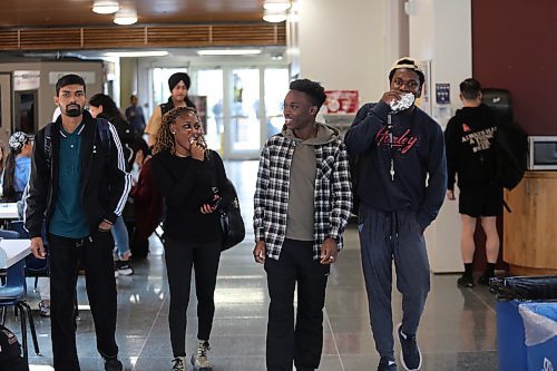 Left; Assiniboine College International Students Ashish Kumar (Finance Advanced), Oluwaseyi Akinsanya (Finance Advanced), Israel Adeniran (Digital Art and Design), and Dara Ayorinde (Network Administration Technology) gist as they walk to the Victoria Ave. East Campus cafeteria on Wednesday afternoon. (Abiola Odutola/The Brandon Sun)