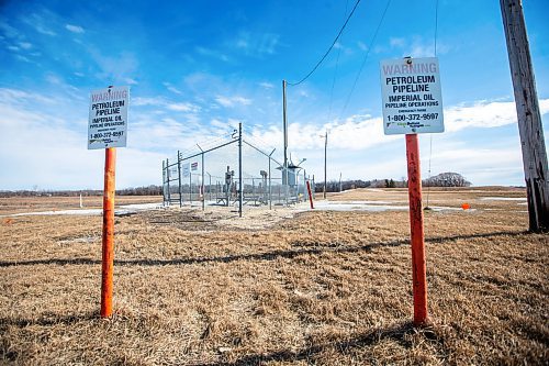 MIKAELA MACKENZIE / FREE PRESS

Imperial Oil pipeline signs just south of St. Adolphe, near the Red River, on Monday, March 18, 2024.  The company has decided to shut down the pipeline and undertake repairs after pipeline inspections identified integrity concerns.

For Katie/Tyler story.