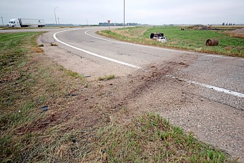 A groove is clearly visible in the ditch leading up to the exit ramp onto the Trans-Canada Highway where the vehicle of an Ontario-registered vehicle left the road early Thursday morning and ended up in the northwest ditch of the intersection with Highway 5 near Carberry. Emergency crews had to take the roof off of the car to reach the driver, who was taken away from the scene by ambulance. (Matt Goerzen/The Brandon Sun)