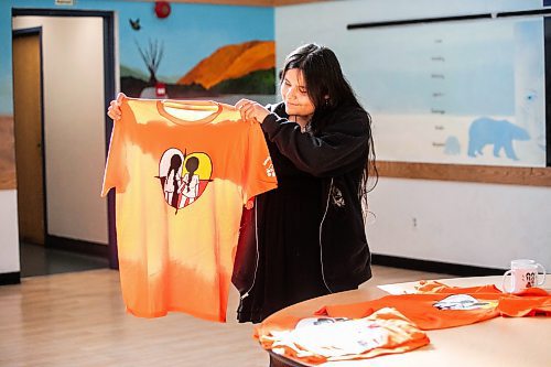 MIKAELA MACKENZIE / WINNIPEG FREE PRESS

Breanna Mink (16), who designed the orange shirt day t-shirts that Rossbrook House is selling to raise funds, at the inner-city drop-in centre on Thursday, Sept. 12, 2024. The unique design features the colours of the four directions and was created by a talented teenaged artist who has been a Rossbrook House participant for several years. Breanna is also one of the Junior Staff, a program that employs participants as young as 13 years of age.

Standup.
Winnipeg Free Press 2024