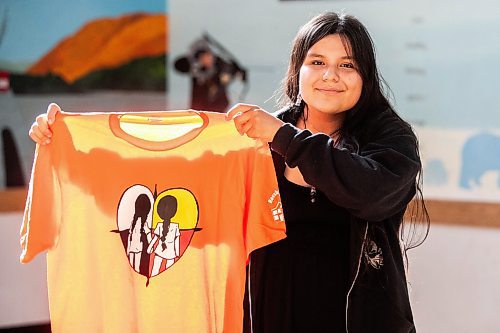 MIKAELA MACKENZIE / WINNIPEG FREE PRESS

Breanna Mink (16), who designed the orange shirt day t-shirts that Rossbrook House is selling to raise funds, at the inner-city drop-in centre on Thursday, Sept. 12, 2024. The unique design features the colours of the four directions and was created by a talented teenaged artist who has been a Rossbrook House participant for several years. Breanna is also one of the Junior Staff, a program that employs participants as young as 13 years of age.

Standup.
Winnipeg Free Press 2024