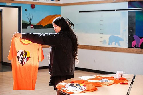 MIKAELA MACKENZIE / WINNIPEG FREE PRESS

Breanna Mink (16), who designed the orange shirt day t-shirts that Rossbrook House is selling to raise funds, at the inner-city drop-in centre on Thursday, Sept. 12, 2024. The unique design features the colours of the four directions and was created by a talented teenaged artist who has been a Rossbrook House participant for several years. Breanna is also one of the Junior Staff, a program that employs participants as young as 13 years of age.

Standup.
Winnipeg Free Press 2024