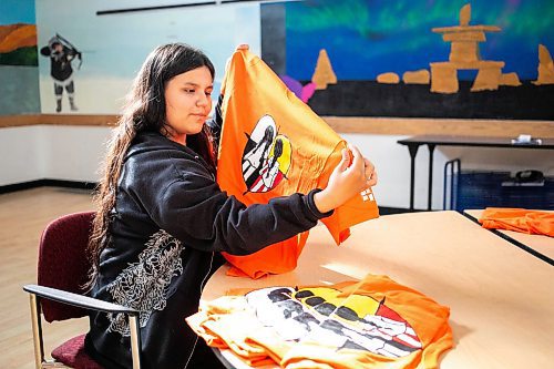 MIKAELA MACKENZIE / WINNIPEG FREE PRESS

Breanna Mink (16), who designed the orange shirt day t-shirts that Rossbrook House is selling to raise funds, at the inner-city drop-in centre on Thursday, Sept. 12, 2024. The unique design features the colours of the four directions and was created by a talented teenaged artist who has been a Rossbrook House participant for several years. Breanna is also one of the Junior Staff, a program that employs participants as young as 13 years of age.

Standup.
Winnipeg Free Press 2024