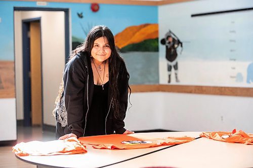 MIKAELA MACKENZIE / WINNIPEG FREE PRESS

Breanna Mink (16), who designed the orange shirt day t-shirts that Rossbrook House is selling to raise funds, at the inner-city drop-in centre on Thursday, Sept. 12, 2024. The unique design features the colours of the four directions and was created by a talented teenaged artist who has been a Rossbrook House participant for several years. Breanna is also one of the Junior Staff, a program that employs participants as young as 13 years of age.

Standup.
Winnipeg Free Press 2024