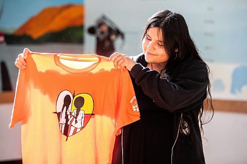 MIKAELA MACKENZIE / WINNIPEG FREE PRESS

Breanna Mink (16), who designed the orange shirt day t-shirts that Rossbrook House is selling to raise funds, at the inner-city drop-in centre on Thursday, Sept. 12, 2024. The unique design features the colours of the four directions and was created by a talented teenaged artist who has been a Rossbrook House participant for several years. Breanna is also one of the Junior Staff, a program that employs participants as young as 13 years of age.

Standup.
Winnipeg Free Press 2024