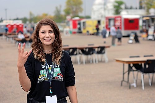 Kyshia Prince-Olsen is working to keep the grounds clean at the Food Truck Warz as guests begin to arrive on Friday. The event has opened up with rides and a variety of food options and is scheduled to run through the weekend until 6 p.m. on Sunday. (Connor McDowell/Brandon Sun)