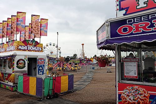 Food stations, carnival rides and a ferris wheel are set up near Keystone Centre as Food Truck Warz has come to Brandon. The event will continue through the weekend, set to close at 10 p.m. on Friday and Saturday, and 6 p.m. on Sunday. (Connor McDowell/Brandon Sun)