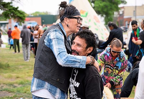 Mike Sudoma/Free Press
Jamie Goulet of Clan Mothers Healing Village shares a moment with participants Leroy Pletts after trimming up his hair and beard as part of the Gizhe Waa Ti-Sii-Win Service Expo Friday afternoon
Sept 13, 2024
