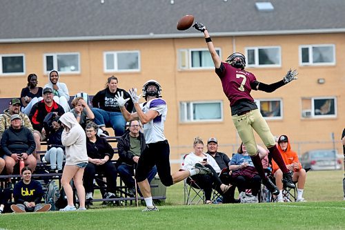 Crocus Plainsmen Erik Solomon tips a pass but Vincent Massey's Logan Van Santen still catches it for a first-half touchdown during their Winnipeg High School Football League game at Massey on Friday. (Thomas Friesen/The Brandon Sun)