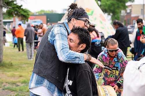 Mike Sudoma/Free Press
Jamie Goulet of Clan Mothers Healing Village shares a moment with participant Leroy Plett after trimming up his hair and beard as part of the Gizhe Waa Ti-Sii-Win Service Expo Friday afternoon
Sept 13, 2024
