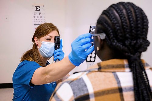 Mike Sudoma/Free Press
Dr Carmen Recksiedler checks a patients vision as the Manitoba Association of Optometrists gives free eye exams during the Gizhe Waa Ti-Sii-Win Service Expo as part of End Homelessness Winnipegs Annual General Meeting Friday
Sept 13, 2024
