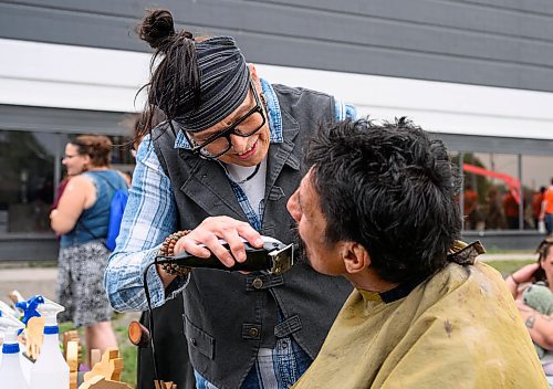 Mike Sudoma/Free Press
Jamie Goulet of Clan Mothers Healing Village trims up Leroy Plett's beard as part of the Gizhe Waa Ti-Sii-Win Service Expo Friday afternoon
Sept 13, 2024
