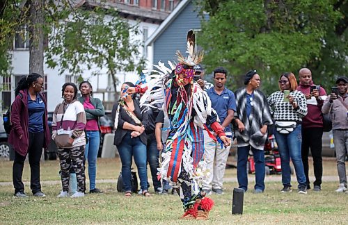 Indigenous powwow dancer Sam Jackson from Sioux Valley Dakota Nation offers a dance demonstration for newcomers to Canada during a free community barbecue at Stanley Park on Friday, part of a Welcoming Week event hosted by the Brandon Local Immigration Partnership. (Matt Goerzen/The Brandon Sun)