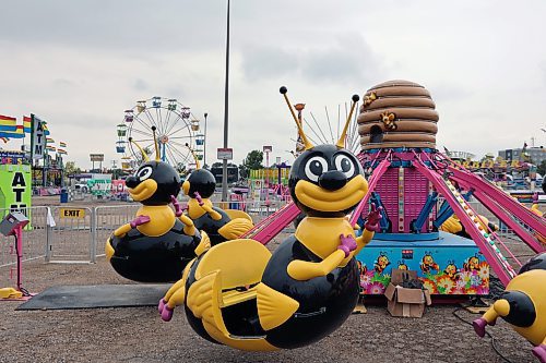 Carnival rides and a ferris wheel are set up near Keystone Centre as Food Truck Warz has come to Brandon. The event will continue through the weekend closing at 10 p.m. on Friday and Saturday, and 6 p.m. on Sunday. (Connor McDowell/Brandon Sun)