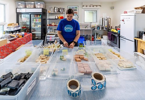 MIKE DEAL / FREE PRESS
Owner-manager Aynsleigh Kerchak works on packaging some of the soaps in the shop. 
Aurora Farm in St. Norbert is celebrating its 20th anniversary this weekend by inviting the public to visit and enjoy tours of the farm and various workshops.
They run the 160-acre farm&#x2019;s operations, which include producing 10,000 bars of goat milk soap a year; running a summer camp so youth can learn about farming; hosting a diversity of programs to facilitate the building of traditional agrarian skills; and offering baby goat yoga, which attracts thousands of visitors annually.
240913 - Friday, September 13, 2024.