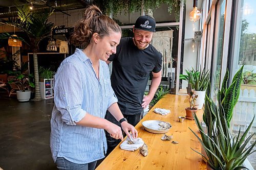 Mike Sudoma/Free Press
Raw Bars Aaron Crawford helps Free Press reporter Eva Wasney through shucking her first oyster At Kilter Brewing Friday afternoon
Sept 13, 2024
