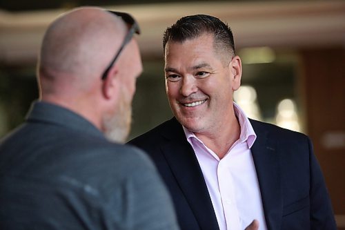 Incoming Brandon Police Chief Tyler Bates speaks with Ward 10 City of Brandon Counc. Tyson Tame during a meet and greet event with the new chief at Brandon City Hall on Friday afternoon. (Matt Goerzen/The Brandon Sun)