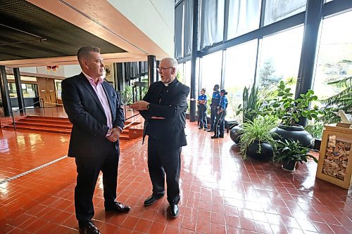 Incoming Brandon Police Chief Tyler Bates speaks with St. Matthews's Cathedral rector Don Bernhardt during a meet and greet event with the new chief at Brandon City Hall on Friday afternoon. (Matt Goerzen/The Brandon Sun)