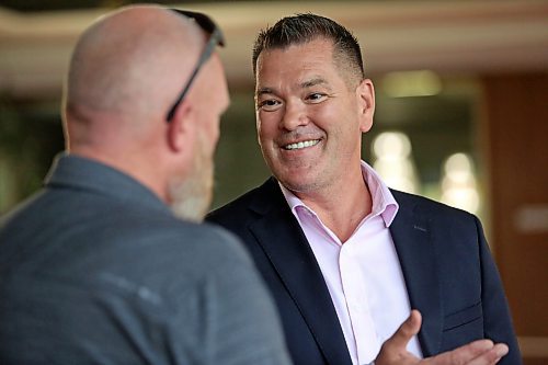 Incoming Brandon Police Chief Tyler Bates speaks with Ward 10 City of Brandon Counc. Tyson Tame during a meet and greet event with the new chief at Brandon City Hall on Friday afternoon. (Matt Goerzen/The Brandon Sun)