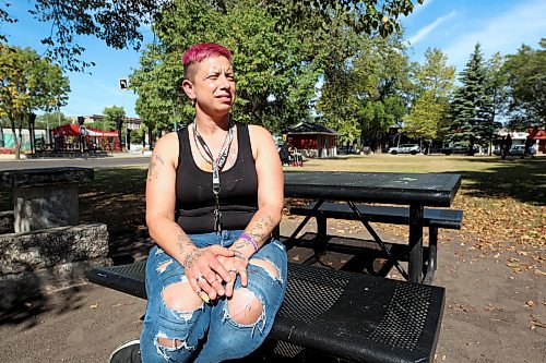 Kat, who requested her last name not be used, sits at a picnic table at Princess Park on Saturday. A while ago, she sent a sample of meth for testing after feeling unexpected side effects from using it. The sample turned out to be 21 per cent fentanyl. (Colin Slark/The Brandon Sun)