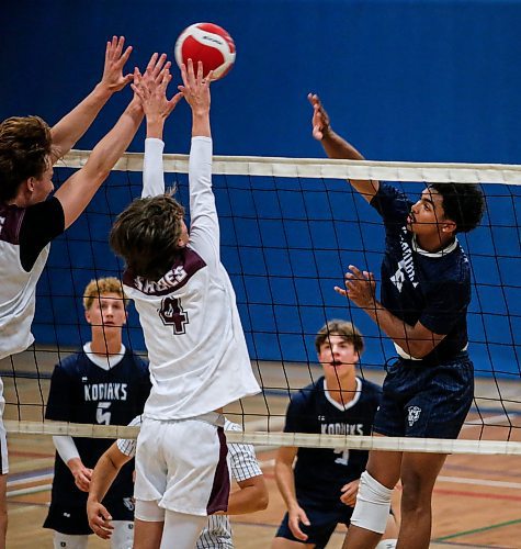 JOHN WOODS / FREE PRESS
River East Connor Freeman (6) hits against Springfield Dylan Bohotchuk (4) in varsity volleyball action at River east Collegiate Monday, September 16, 2024. 

Reporter: s/u