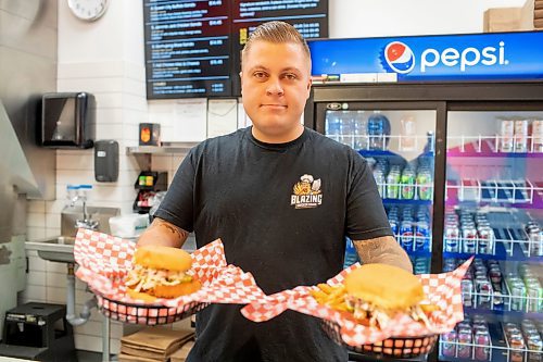 BROOK JONES / FREE PRESS
Winnipegger Eric Saniuk, 30, owner of Blazing Chicken Shack, serves a Queen City Buffalo Sando and a Music City Nashville Sando at his restuarant at 392 Graham Ave., in Winnipeg, Man., Monday, Sept. 16, 2024. Saniuk hosted a grand opening Friday, Sept. 13, 2024.