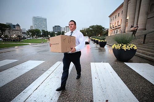 Ruth Bonneville / Free Press

LOCAL - NDP Mark Wasyliw Packs bags

NDP MLA Fort Garry, Mark Wasyliw,  walks out of the Legislative Building with boxes Monday after dispute with the NDP leader, Wab Kinew.  On his way to his car in the rain carrying one of several boxes to be loaded he says that Kinew needs help and that he's glad to be gone.  

See story by Kevin.  

Sept 13th,  2024