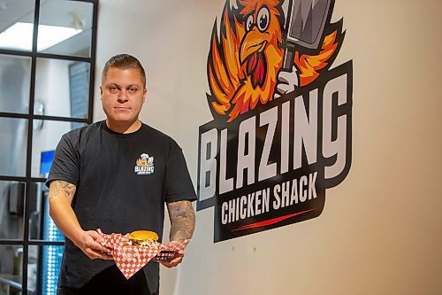 BROOK JONES / FREE PRESS
Thirty-year-old Eric Saniuk who is the owner of Blazing Chicken Shack is pictured holding a Music City Nashville Sando at his restaurant at 392 Graham Ave., in Winnipeg, Man., Monday, Sept. 16, 2024. Saniuk hosted a grand opening Friday, Sept. 13, 2024.