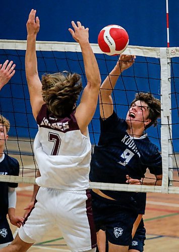 JOHN WOODS / FREE PRESS
River East Eli Ulrich (9) hits against Springfield Noah Mushuluk (7) in varsity volleyball action at River east Collegiate Monday, September 16, 2024. 

Reporter: s/u