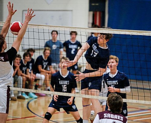 JOHN WOODS / FREE PRESS
River East Nikolas Horton (13) hits against Springfield Liam Bruchanski (5) in varsity volleyball action at River east Collegiate Monday, September 16, 2024. 

Reporter: s/u